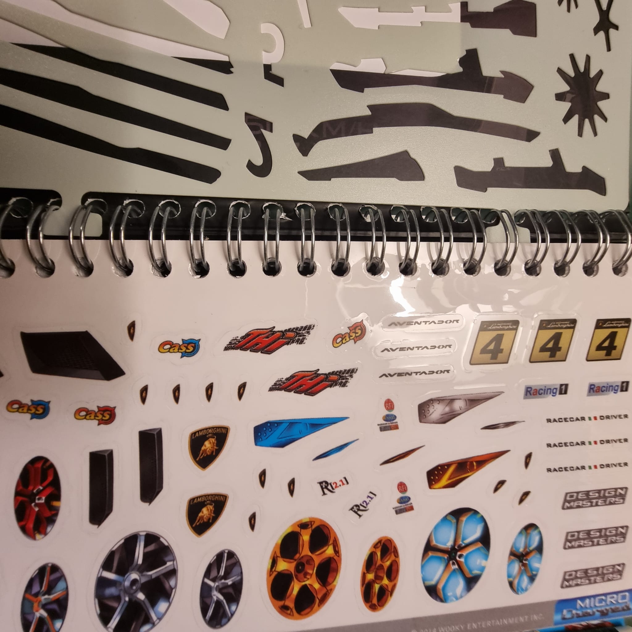 Sheet of stickers for model cars, including a variety of decals for Lamborghini Aventador, featuring logos, racing numbers, and detailed designs.