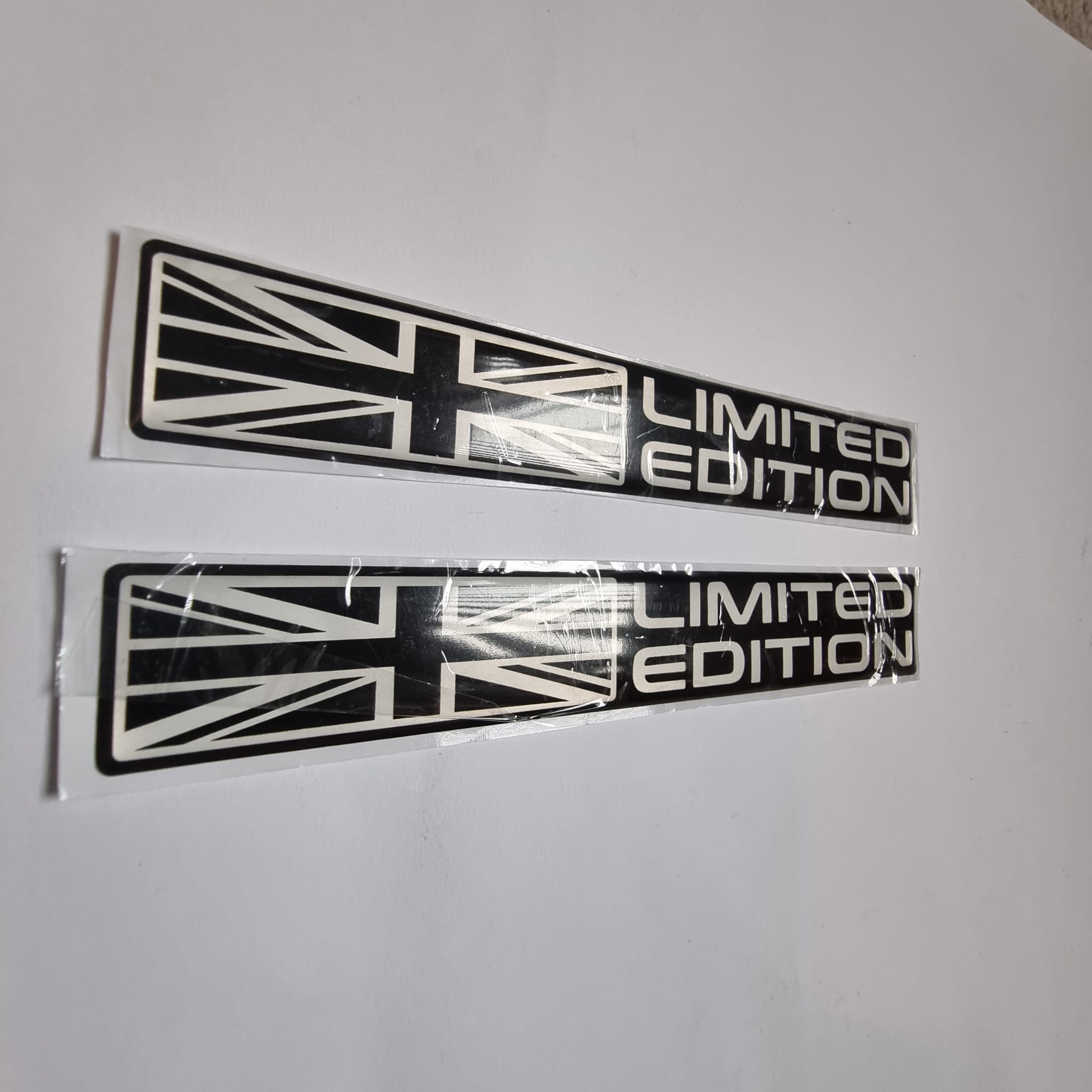 Pair of "Limited Edition" Union Jack car decals, black and silver chrome stickers for vehicle styling.